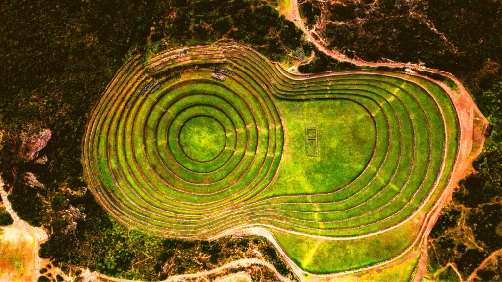 A stunning aerial perspective of the circular terraces of Moray, an ancient Inca agricultural site - Inka Trail