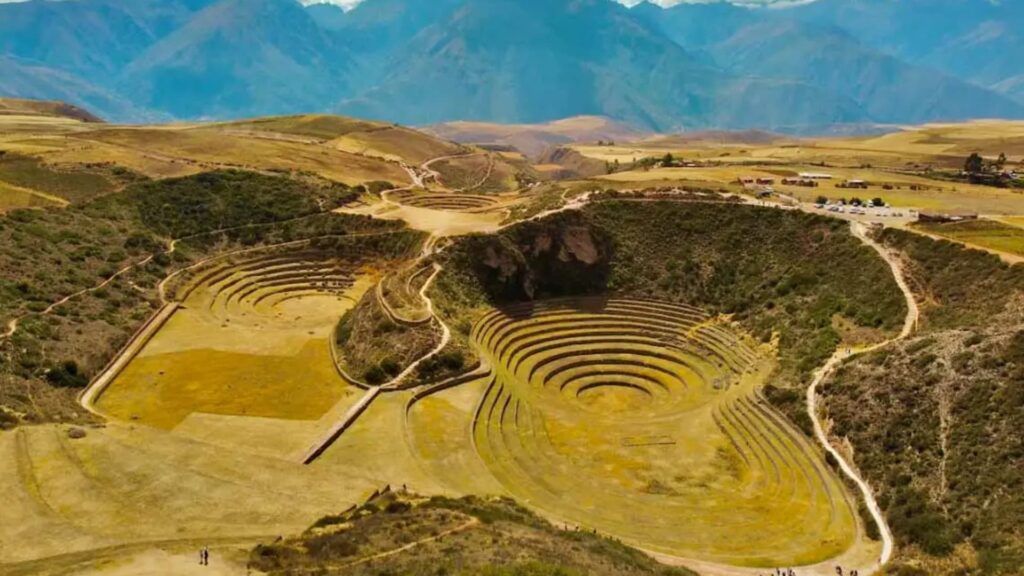 Aerial view of Moray, a circular Inca terrace system in the Sacred Valley, Peru, used for agricultural experimentation.