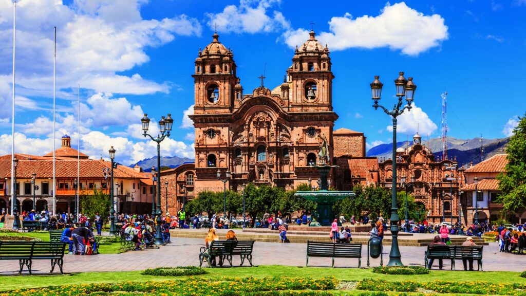 The Plaza de Armas of Cusco with the Church of the Society of Jesus in the background, a historic and vibrant place