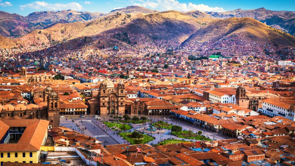 Panoramic view of Plaza de Armas in Cusco with the cathedral and the Andes in the background - Inca Trail