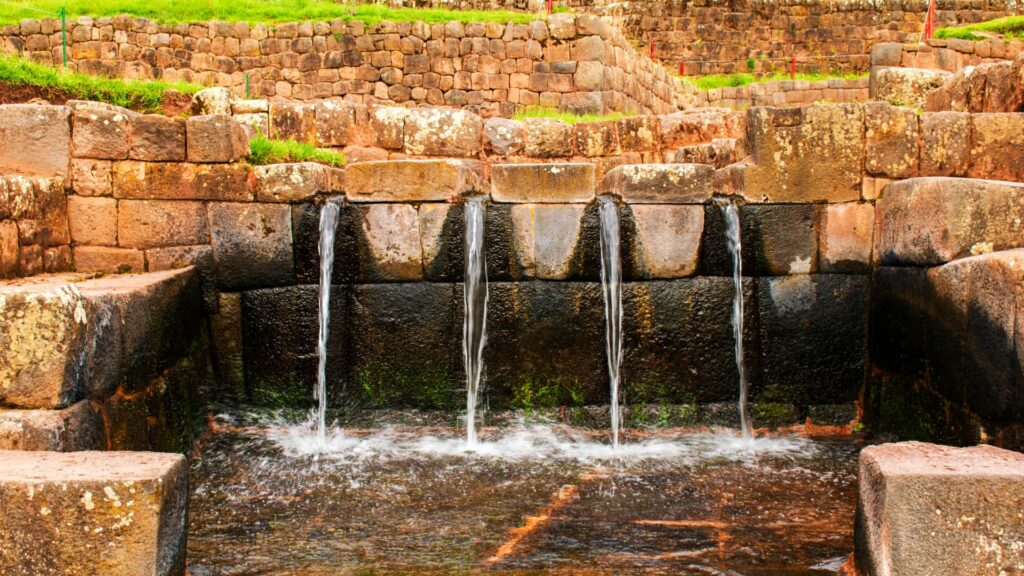 Ancient Inca water channels and fountains at Tipón, showcasing advanced hydraulic engineering near Cusco.