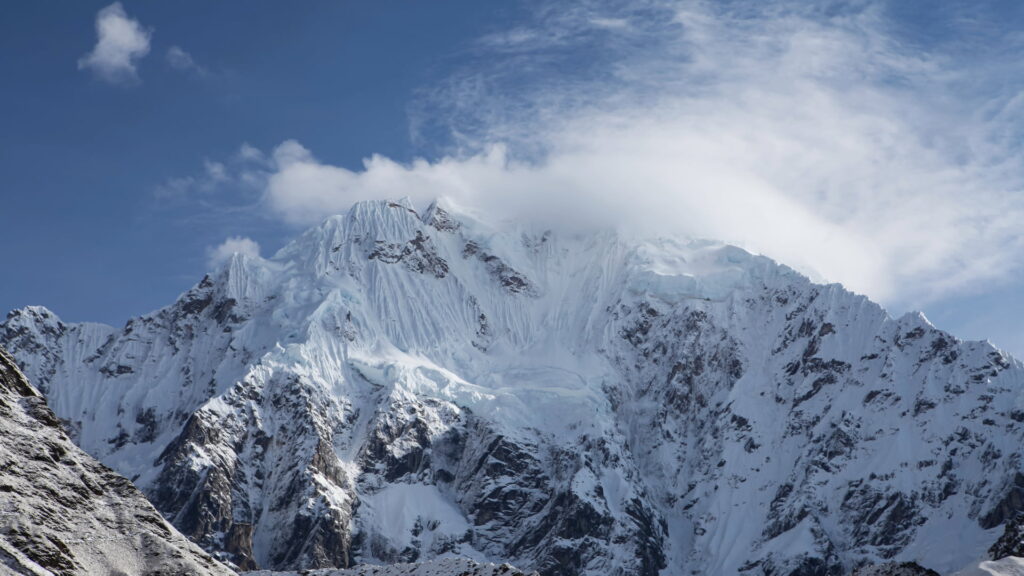 Breathtaking view of Nevado Salkantay, a majestic snow-capped peak in the Peruvian Andes - Inka Trail Peru.info