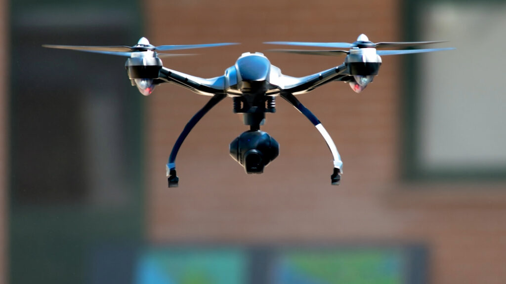 Professional drone with camera flying, capturing high-quality aerial footage - Inka Trail Peru.info