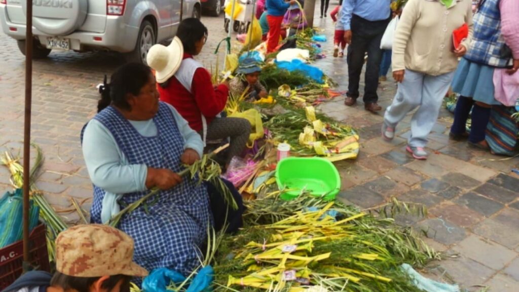 Women crafting and selling palm leaf arrangements on the streets of Cusco for Palm Sunday celebrations - Inka Trail Peru.info